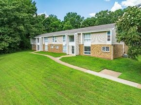 Chester apartment for rent - Apartment building with a green lawn in front.