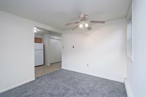 Duncannon apartment for rent - A room with a ceiling fan and a grey carpet.