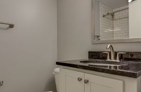 Nashville apartment for rent - A bathroom with a sink and a mirror.