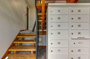 Nashville apartment for rent - A set of white mailboxes with numbers 11 to 26 are on the right.