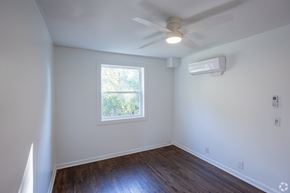 Nashville apartment for rent - A room with a window and a ceiling fan.