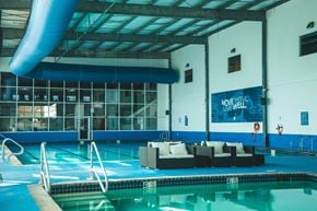 Biloxi apartment for rent - A pool with a sign that says "Move Well" on the wall.
