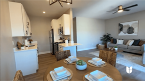 Biloxi apartment for rent - A modern kitchen with a dining table set for two.