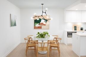 Vancouver apartment for rent - A dining room with a white table and chairs.