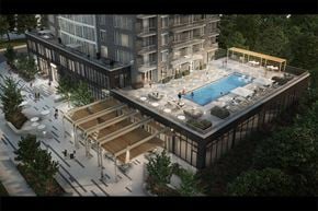 Ottawa apartment for rent - A modern building with a pool and a wooden deck.