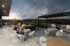 Ottawa apartment for rent - A modern outdoor dining area with people sitting around a table.