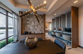 Richardson apartment for rent - A modern bedroom with a large bed and a view of the outside.