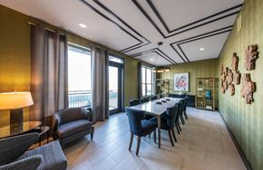 Richardson apartment for rent - A dining room with a long table and chairs.
