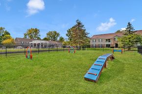 Ann Arbor apartment for rent - A playground with a blue slide and orange rings.