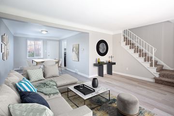 Oak Park apartment for rent - A living room with a grey couch and a coffee table.