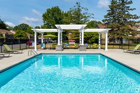 Ann Arbor apartment for rent - A pool with a white pergola over it.