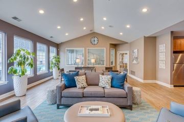 Westland apartment for rent - A living room with a grey couch and a coffee table.