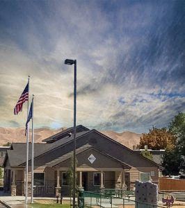Emmett apartment for rent - a house with two flags and a street light in front of it