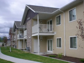 Butte apartment for rent - an apartment building with a balcony and a sidewalk