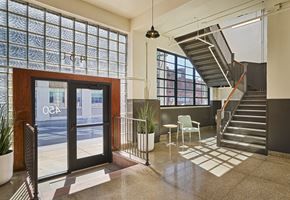 Detroit apartment for rent - A glass door with the word "OCE" on it.