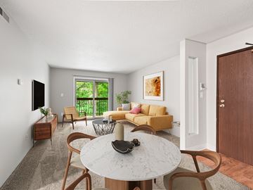 Lansing apartment for rent - A modern living room with a white marble table and wooden chairs.