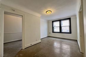 Detroit apartment for rent - A room with a window and a door.