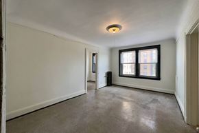 Detroit apartment for rent - A room with a window and a door.