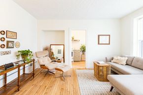 Detroit apartment for rent - A living room with a chair, a couch, and a table.