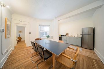 Detroit apartment for rent - A kitchen with a table and chairs in the middle of the room.