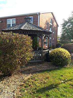 Ligonier apartment for rent - a gazebo in a yard in front of a house