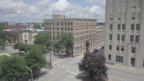 Evansville apartment for rent - an aerial view of a city street with buildings and trees