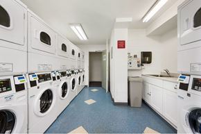 Chicago apartment for rent - A row of washing machines in a public laundromat.