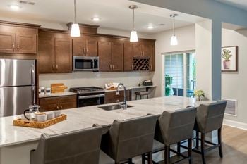 Elegant kitchens with stainless steel appliances & granite countertops