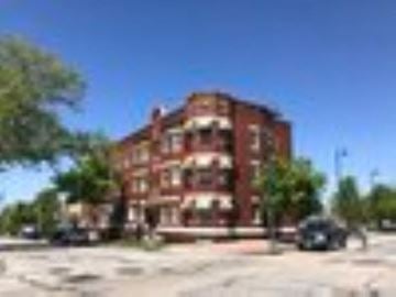Cleveland apartment for rent - a red building with a car parked in front of it