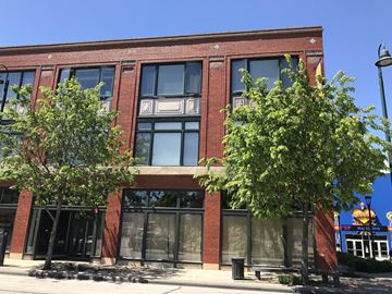 Cleveland apartment for rent - a red brick building with two trees in front of it