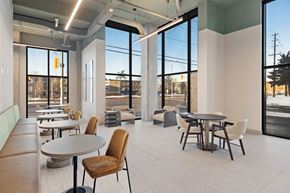 Ottawa apartment for rent - A modern dining area with a table and chairs.