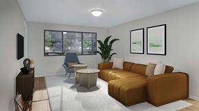 Bozeman apartment for rent - A living room with a brown couch, a blue chair, a white rug, and two framed pictures on the wall.