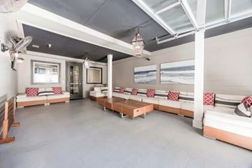 San Antonio apartment for rent - A living room with a couch and a table.