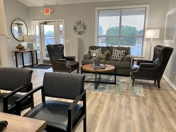 San Angelo apartment for rent - A living room with a grey couch, two chairs and a coffee table.
