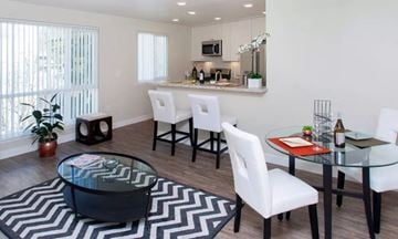 Burlingame apartment for rent - a living room and dining room with a table and chairs