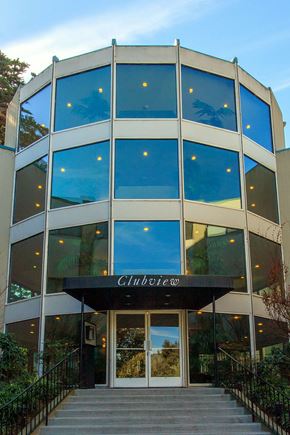 South San Francisco apartment for rent - a building with blue windows and a staircase in front of it