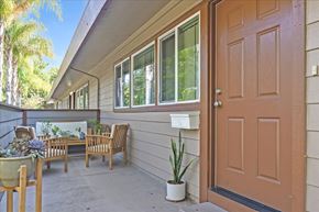Menlo Park apartment for rent - the front door of a house with chairs and a table