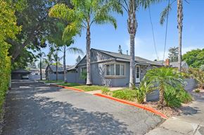 Menlo Park apartment for rent - A building with a driveway and trees in front.