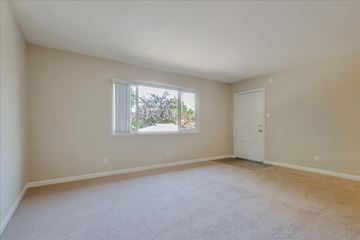 Menlo Park apartment for rent - a spacious living room with a large window and carpet