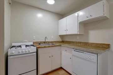 Mountain View apartment for rent - a kitchen with white appliances and white cabinets