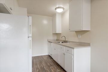 Menlo Park apartment for rent - a kitchen with white cabinets and a white refrigerator