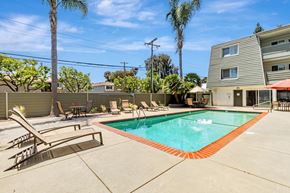 Palo Alto apartment for rent - A pool with a red border and a slide in the middle.