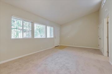 Menlo Park apartment for rent - a spacious living room with a large window and carpet