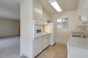 Menlo Park apartment for rent - A kitchen with white appliances and cabinets.