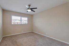 Mountain View apartment for rent - A room with a ceiling fan and a window with blinds.