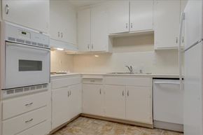 Menlo Park apartment for rent - A kitchen with white cabinets and appliances.