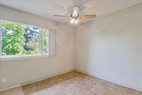 Menlo Park apartment for rent - a living room with a large window and a ceiling fan