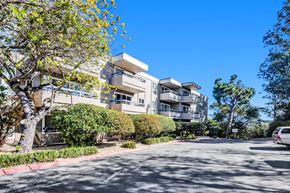San Mateo apartment for rent - A modern apartment building with a tree in front of it.