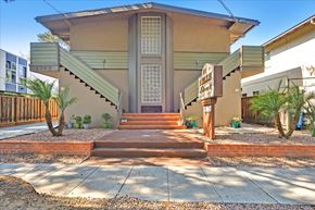 Menlo Park apartment for rent - a building with stairs and a sign in front of it