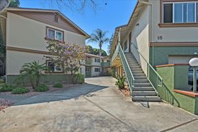 Menlo Park apartment for rent - a sidewalk in front of two buildings with stairs